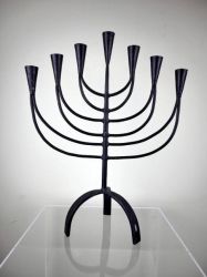 Menorah made of forged and beaten iron